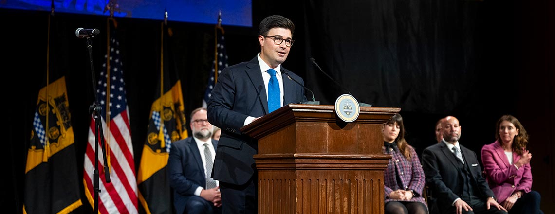 O'Connor speaking at podium #2.
