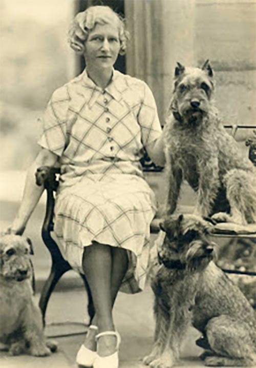 Photo of Mary Flinn Lawrence with her dogs.