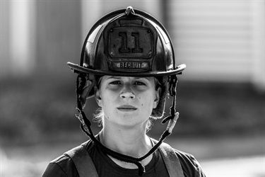 Fire fighter with helmet profile.