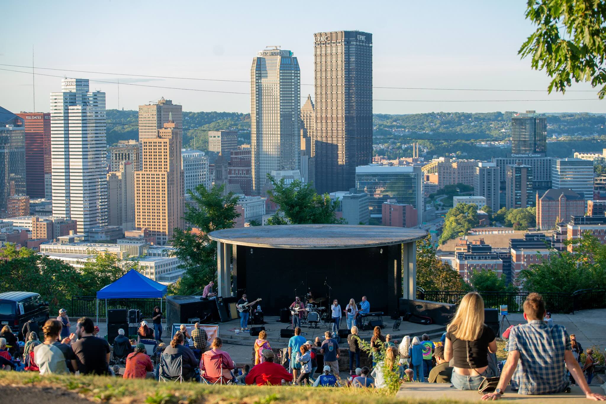 Image of a concert at Grandview Park overlooking the city skyline