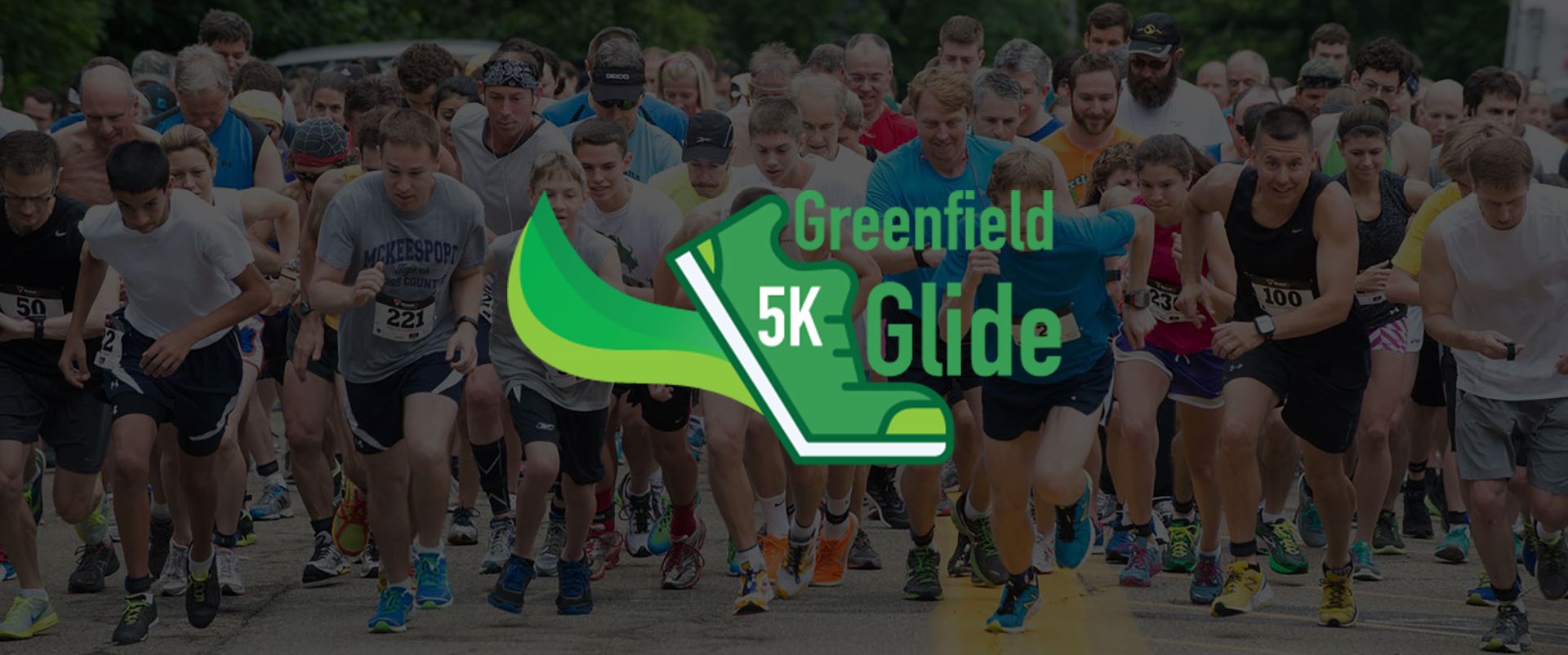 Background image for Greenfield Glide website. Runners beginning race with Greenfield Glide Running Shoes Logo overlaid.