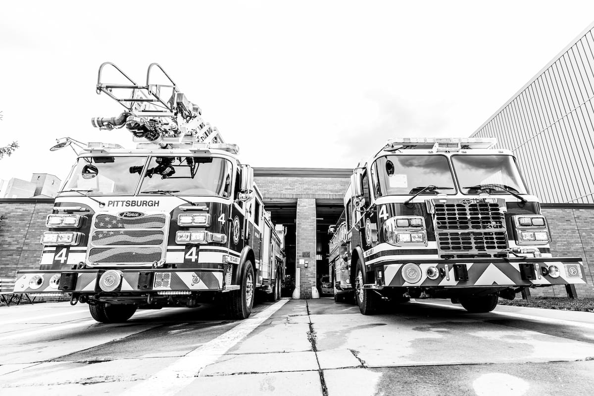Two firetrucks in Uptown.