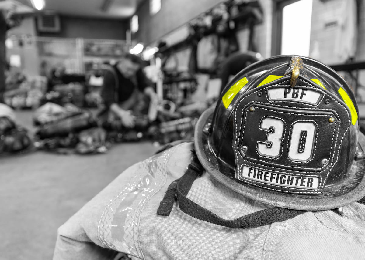 Firefighter helmet on top of gear.